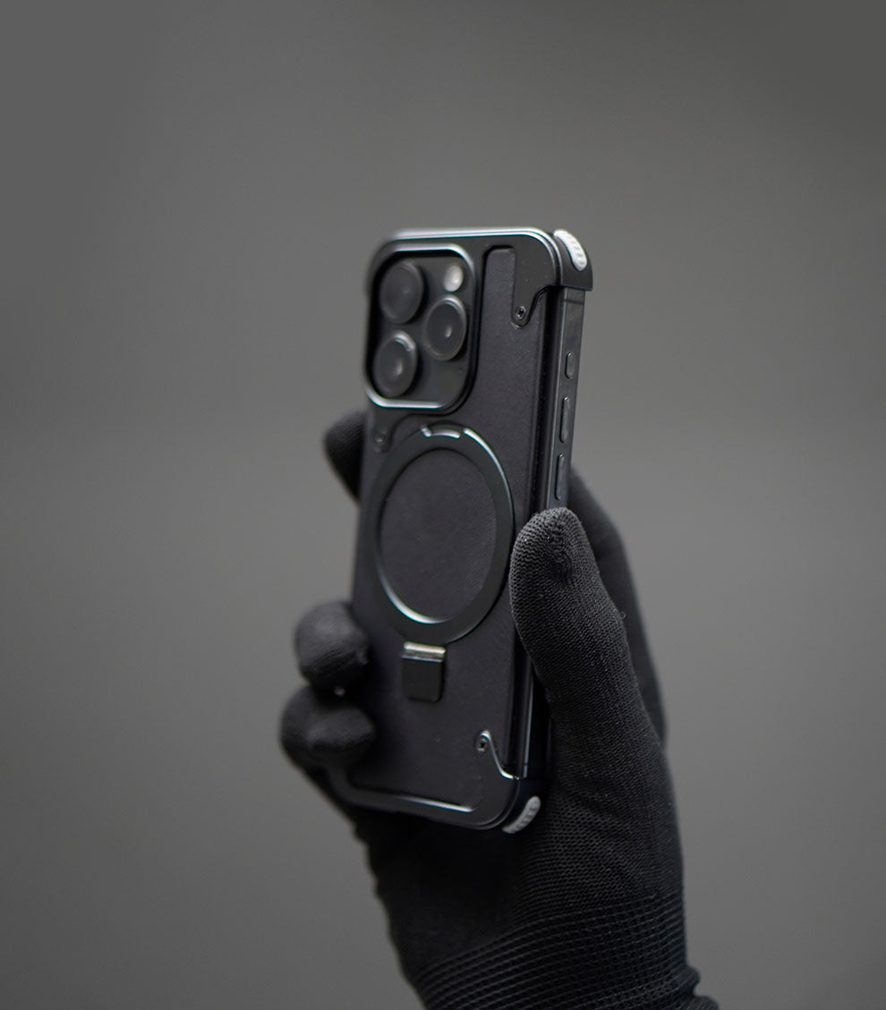 Durable black phone case featuring magnetic stand and protection
