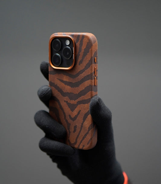 Luxury animal print phone case in brown and black suede texture