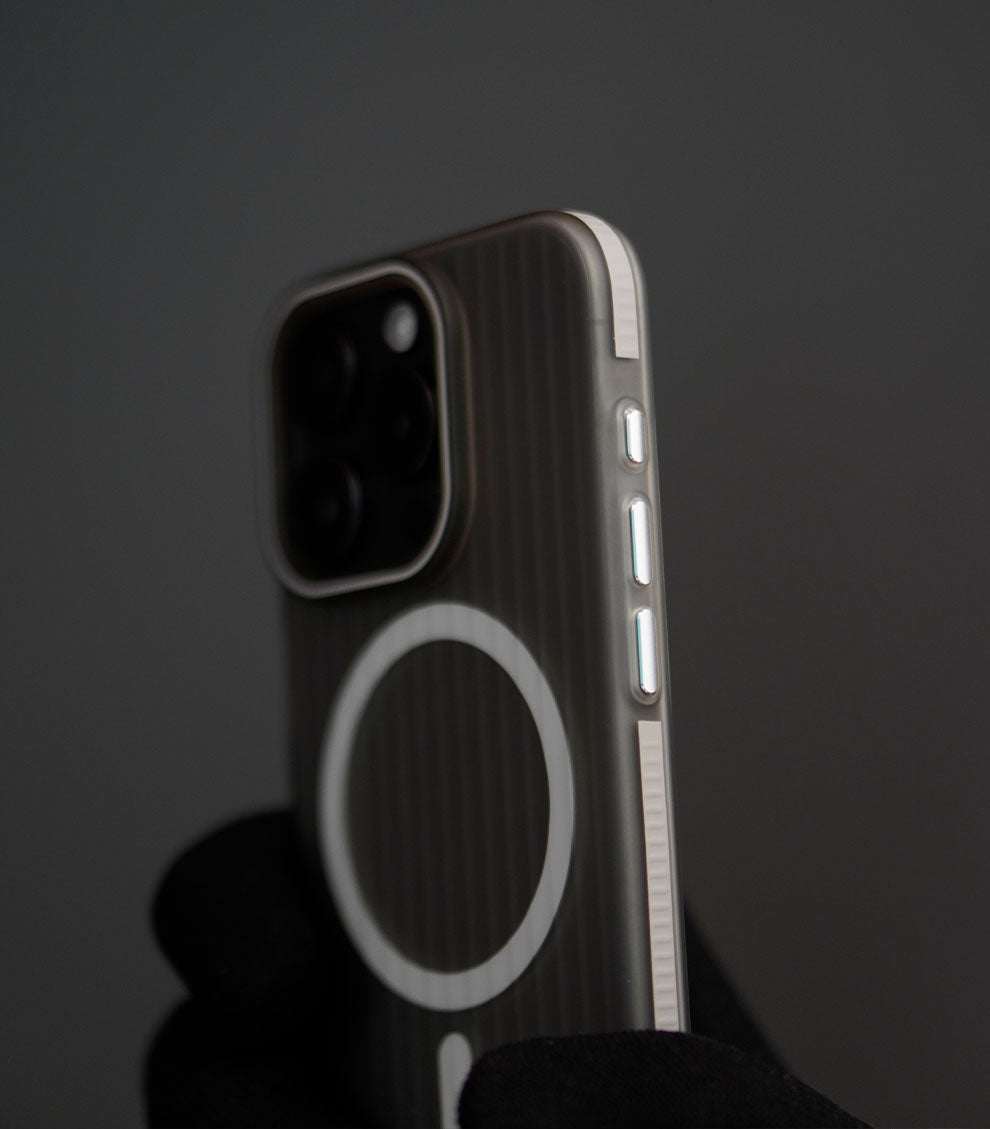 Minimalist gray corrugated MagSafe case showing texture and camera protection