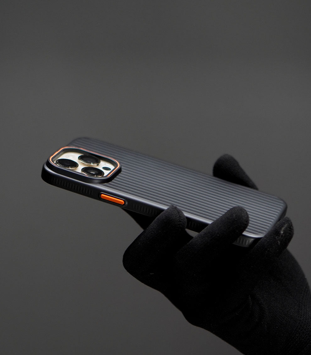 Protective iPhone case with textured grip and orange accent