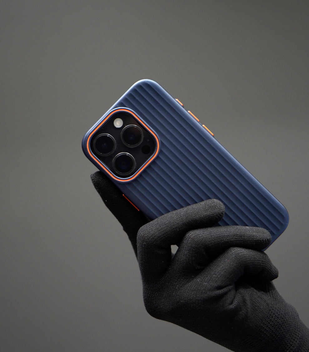 Stylish matte navy iPhone case with ribbed grip and orange detailing