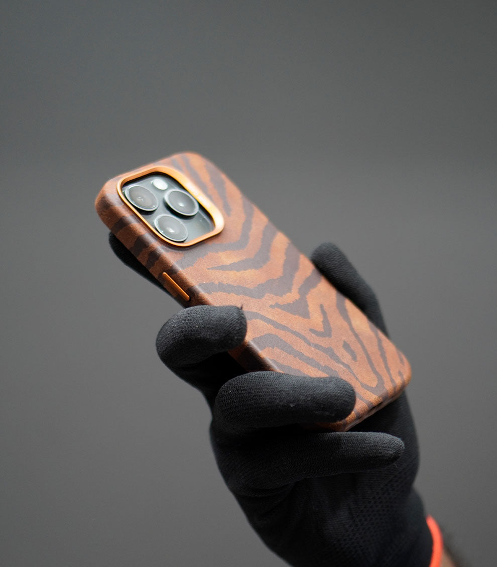 Stylish tiger pattern iPhone case with orange button accents