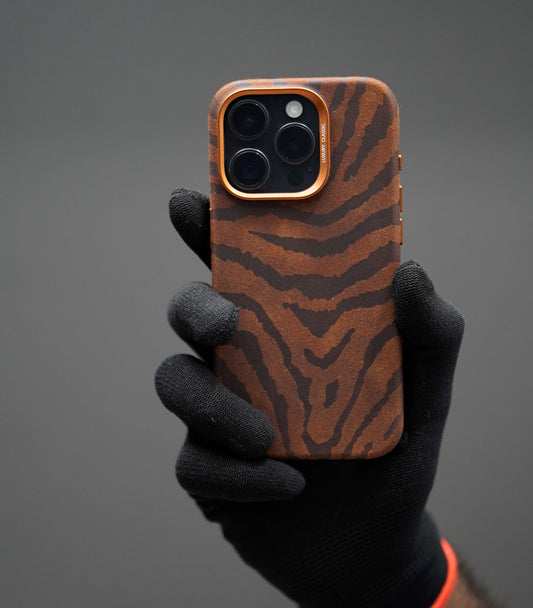 Brown tiger stripe iPhone case with orange metallic camera trim