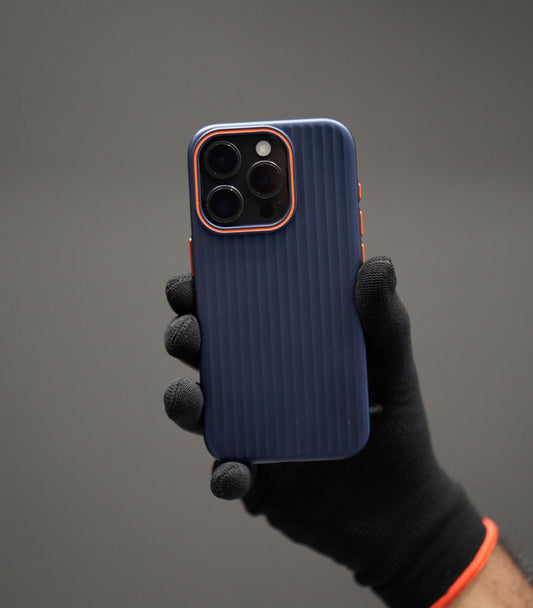 Navy blue ribbed iPhone case with orange camera trim and buttons