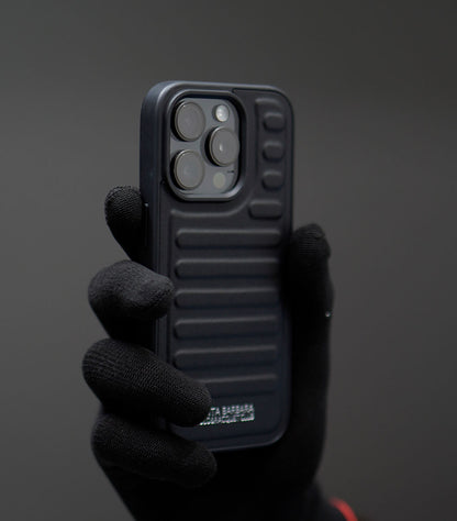Premium ribbed silicone phone case with raised camera protection in matte black finish