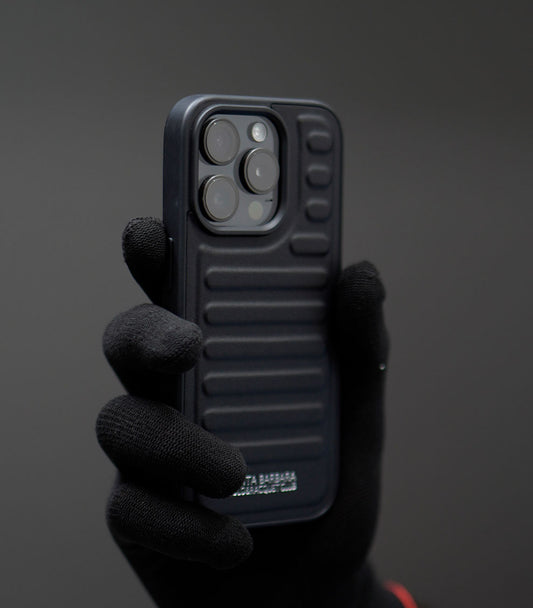 Premium ribbed silicone phone case with raised camera protection in matte black finish